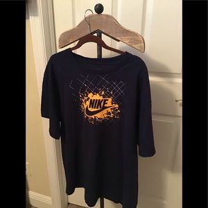 NavyNike T shirt.  Yellow Nike logo on front.